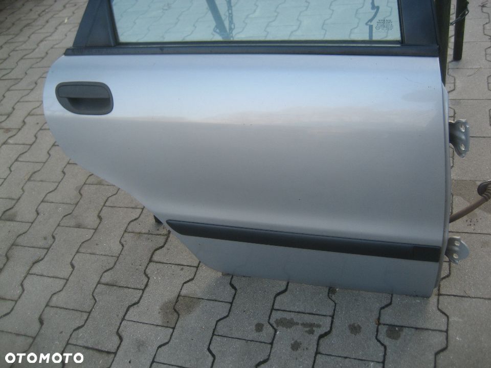 volvo s40 96-00r drzwi tył  prawe srebne kod lakieru 324 12 - 2