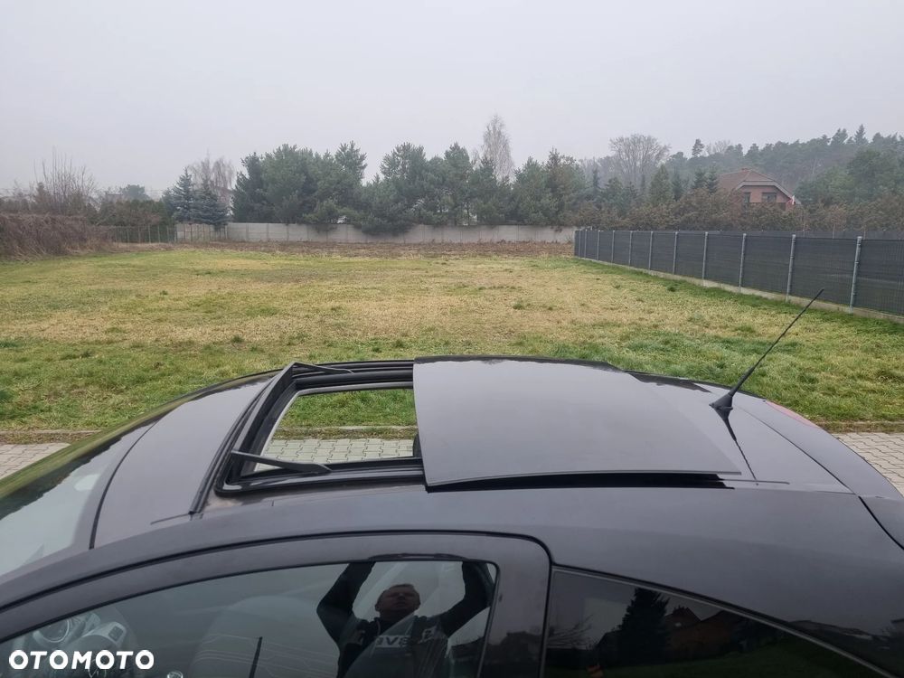 Opel Corsa 1.4 16V Cosmo - 14