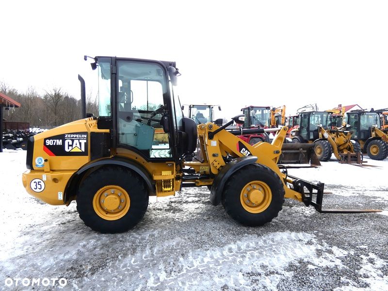 Caterpillar CAT 907M Z Niemiec / Wyjątkowo Wyposażony / 35km/h / 3.050mtg / - 10
