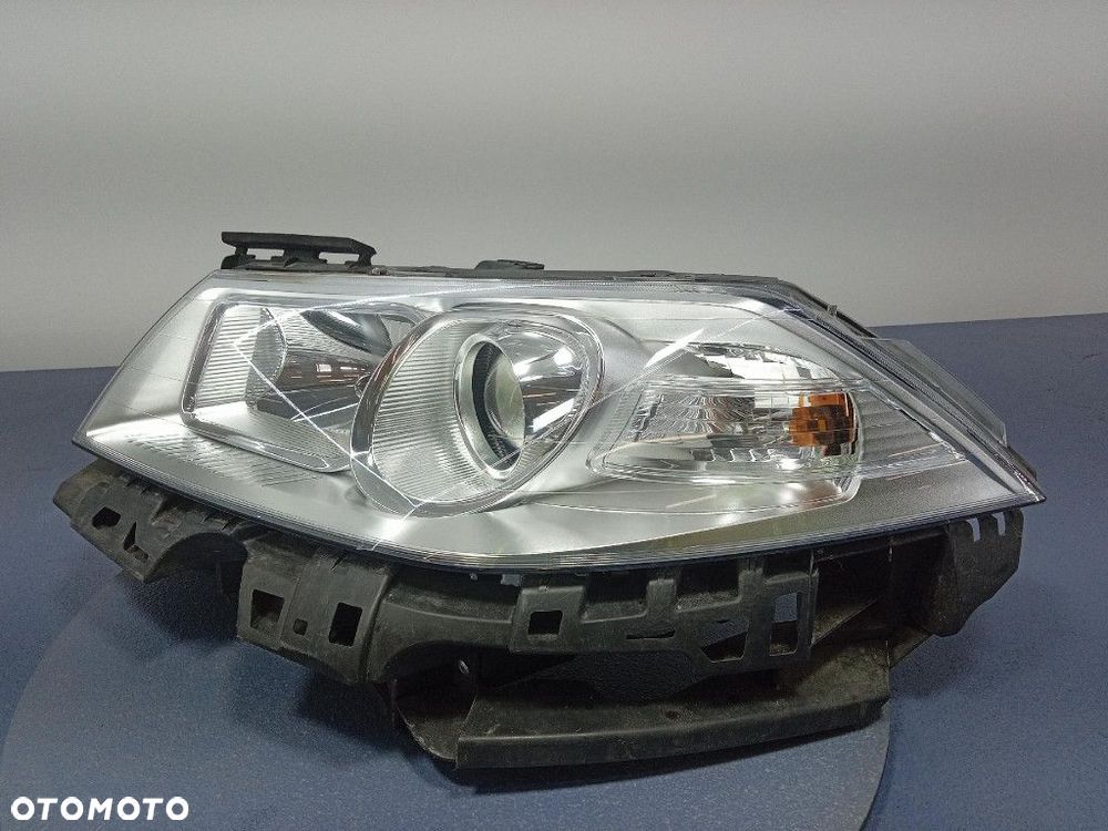 RENAULT MEGANE II LIFT 06- REFLEKTOR LEWY SOCZEWKA EU 89312739 - 2