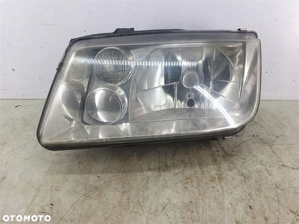 Reflektor lampa przód lewa VW Bora  1999-2006 HELLA - 1