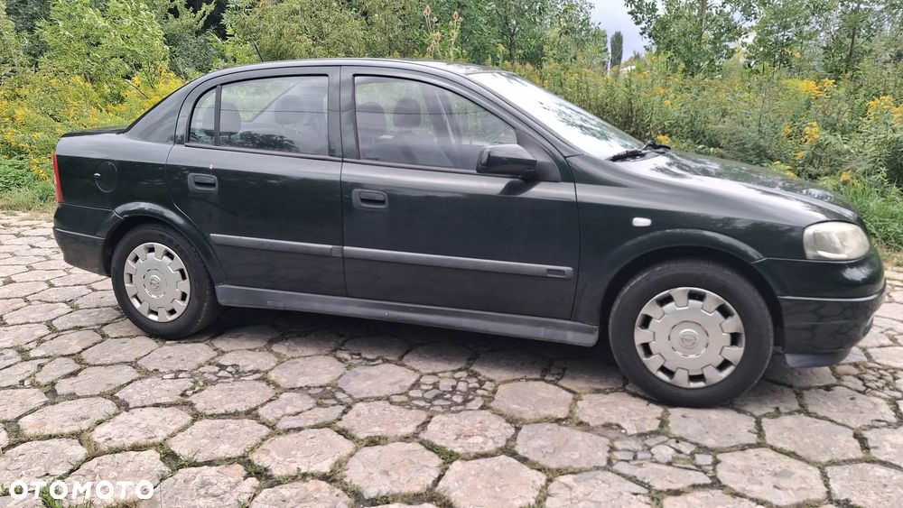 Na części Opel Astra G II SEDAN silnik 1.6 X16XEL Z16XE lakier Z380 skrzynia maska zderzak drzwi klapa szyba fotel kanapa lusterko lampa deska GWARANCJA !!! Przód Tył Zestaw Komplet Drzwi Klapa Zderzak Błotnik Maska Grill Atrapa Szyba Pas Lampa Lusterko Boczki Fotel Kanapa Kokpit Deska Rozdzielcza Przełącznik Włącznik Sterownik Przewody Wiązka Instalacja Moduł Komputer Czujnik Listwa Pompa Alternator Wtryski Głowica Rozrusznik Kompresor Sprzęgło Dwumas Silnik  Skrzynia ABS Klimatyzacji Paliwa Wspomagania Kolektor Turbina Przepustnica Zawór Chłodnica Koło Hak Belka Sanki Zawieszenie Mcpherson Półoś Amortyzator Wydech Tłumik Zacisk Most - 8
