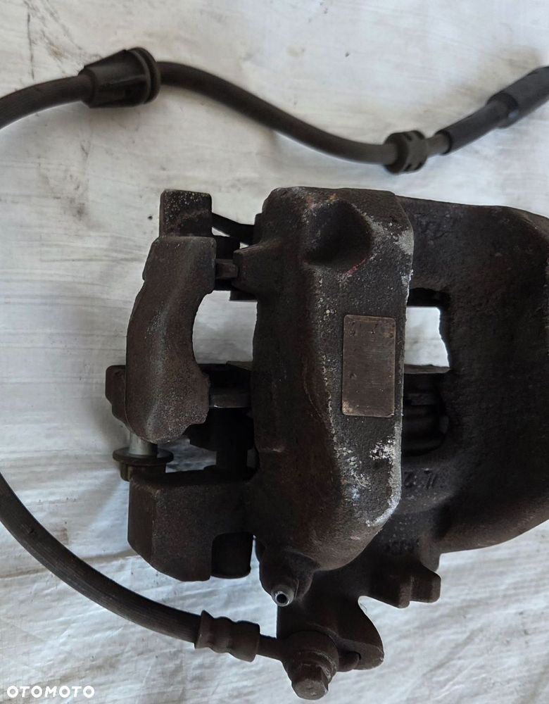 ZACISK HAMULCA LEWY PRZÓD OPEL COMBO E - 2