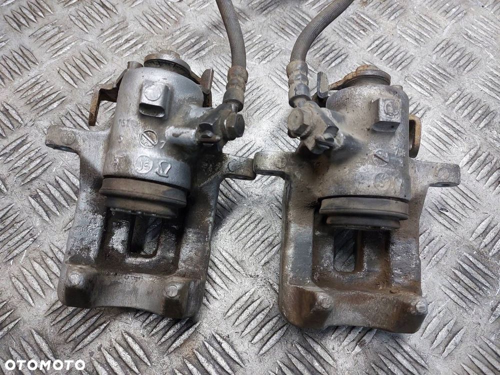 TARCZE HAMULCOWE TYŁ + KLOCKI + ZACISKI AUDI A4 B7 2.0 TDI - 10