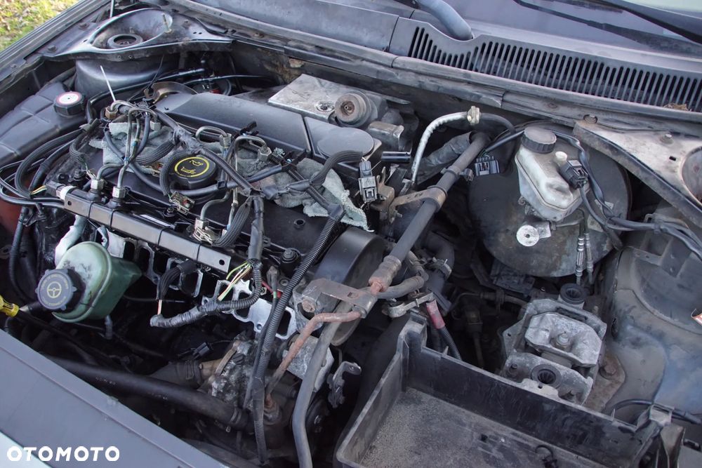 Auto na części - Ford Mondeo MK3 Lift 2.0 TDCI 130 KM 4S7Q-6006-EA 5S7R-7002-CA 2MWE 2005R Silnik Skrzynia Drzwi Maska Klapa Zderzak Błotnik Szyba Lusterko Deska Kokpit Sterownik Moduł Czujnik Licznik Kierownica Panel - 18