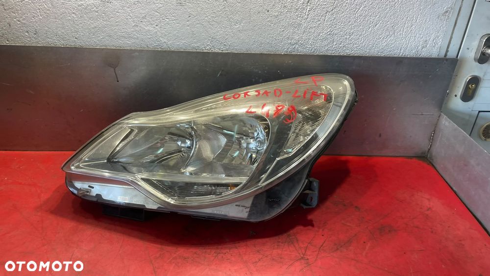 REFLEKTOR LAMPA LEWY OPEL CORSA D LIFT ORYGINAŁ EUROPA - 2