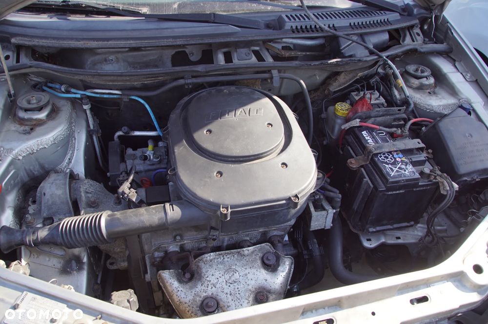 Auto na części - Fiat Punto II 1.2 8V 60 KM 188A4000 2003R Silnik Skrzynia Drzwi Maska Klapa Zderzak Błotnik Szyba Lusterko Deska Kokpit Sterownik Moduł Licznik Kierownica - 15