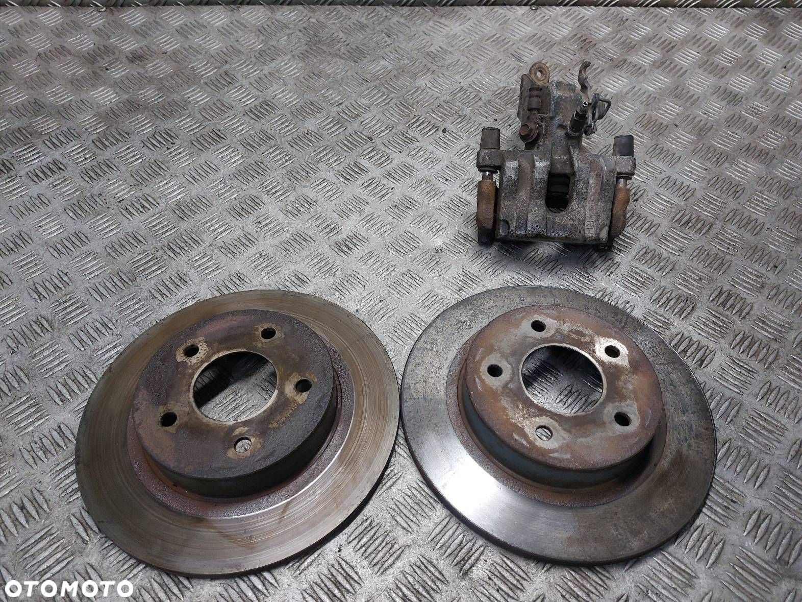 TARCZE HAMULCOWE TYŁ + ZACISK PRAWY NISSAN PRIMERA P12 - 1