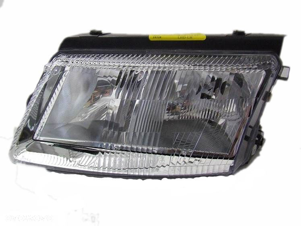 LAMPA REFLEKTOR VW PASSAT B5 97-00 NOWY L/P H4H7