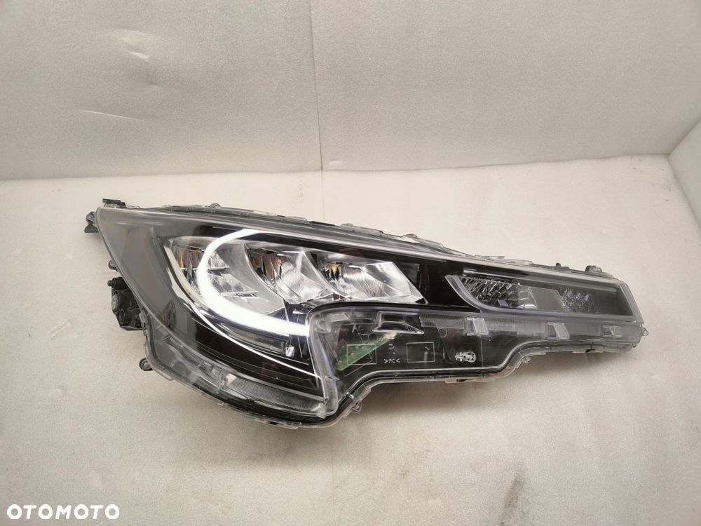 toyota corolla e21 przed lift pół led lampa prawy przód - 1