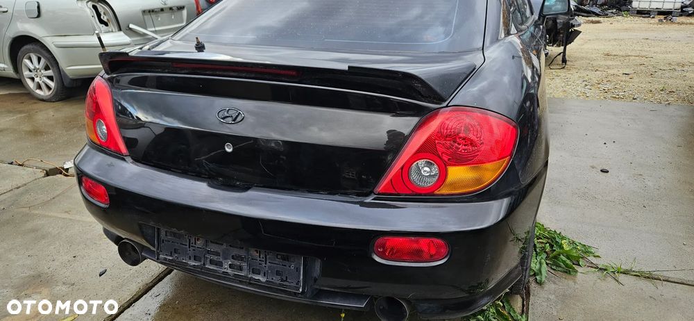 Klapa tylna bagażnika Hyundai Coupe II 2003r lak. EB - 1