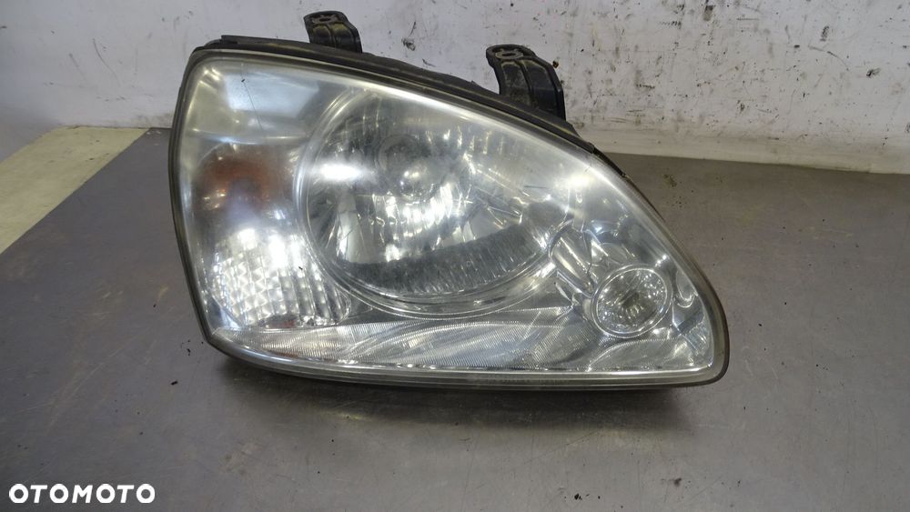LAMPA PRAWA PRZEDNIA KIA CARENS II - 1