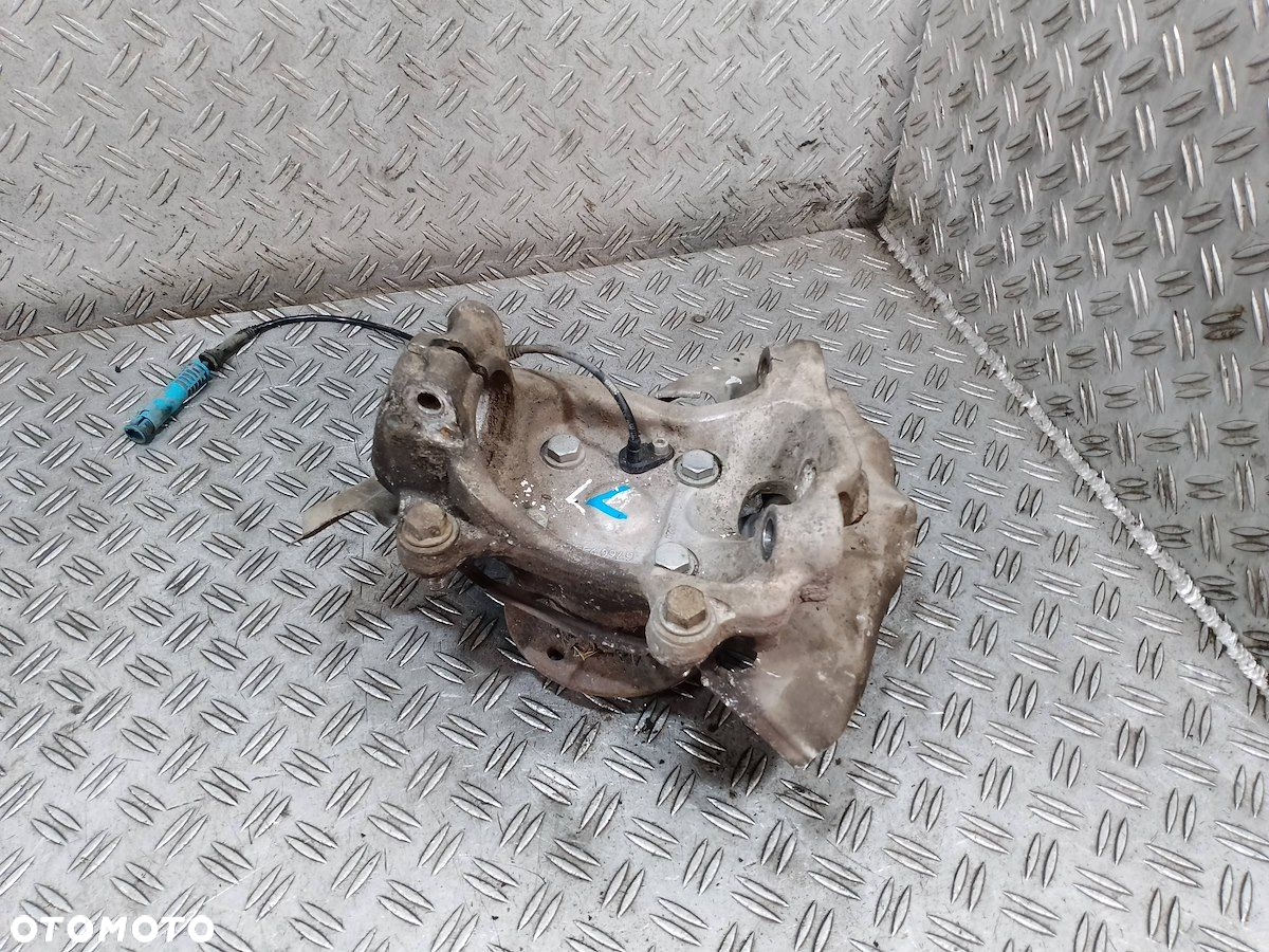 ZWROTNICA LEWY PRZÓD BMW E61 6760953L   1301054300220 2.5 - 7