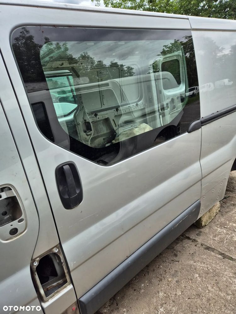 DRZWI LEWE SUWANE BOCZNE TRAFIC VIVARO PRIMASTAR  01-14r. CMG64 - 2