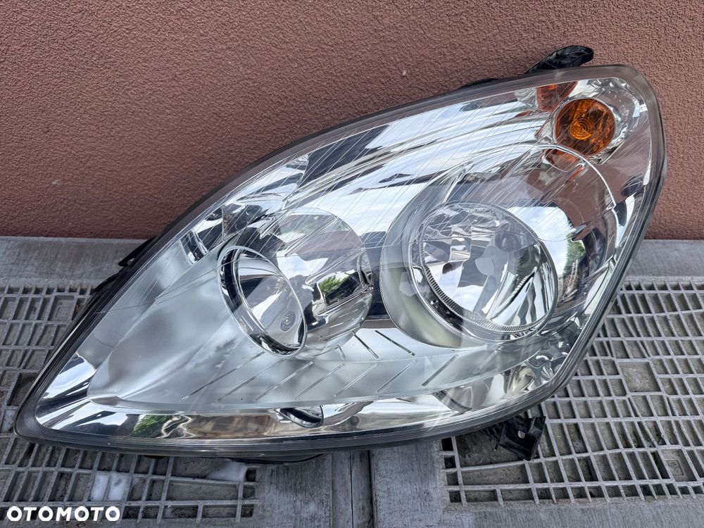 Lampa przednia OPEL ZAFIRA B LIFT JASNA LEWA EUROPA ORYGINALNA AL - 1