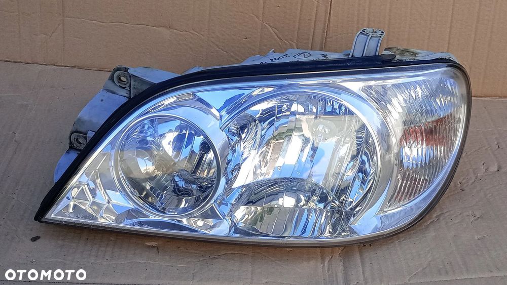 Reflektor lewy Lampa lewa Kia Carnival 2001-
