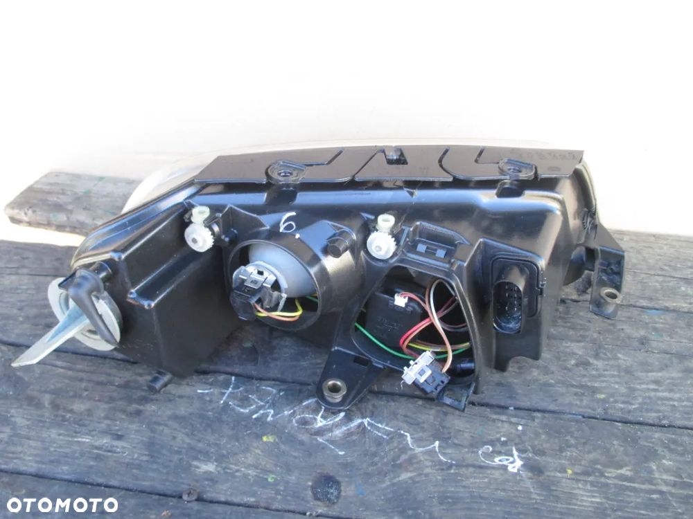 Lampa lewa PASSAT B5 LIFT HELLA EUROPA - 4