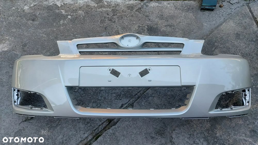 Toyota Corolla E12 04-07 LIFT zderzak przedni hatchback  kod lakieru 1C0 - 1