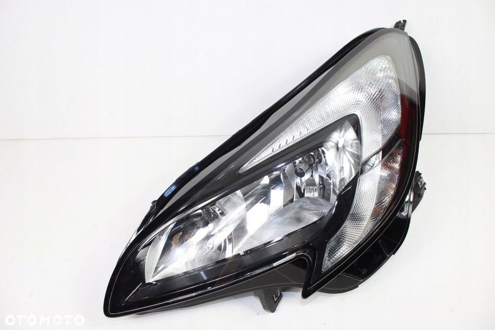 OPEL CORSA E REFLEKTOR LEWY ZWYKŁY UŻYWANY ORYGINALNY GM 39108222 EUROPA