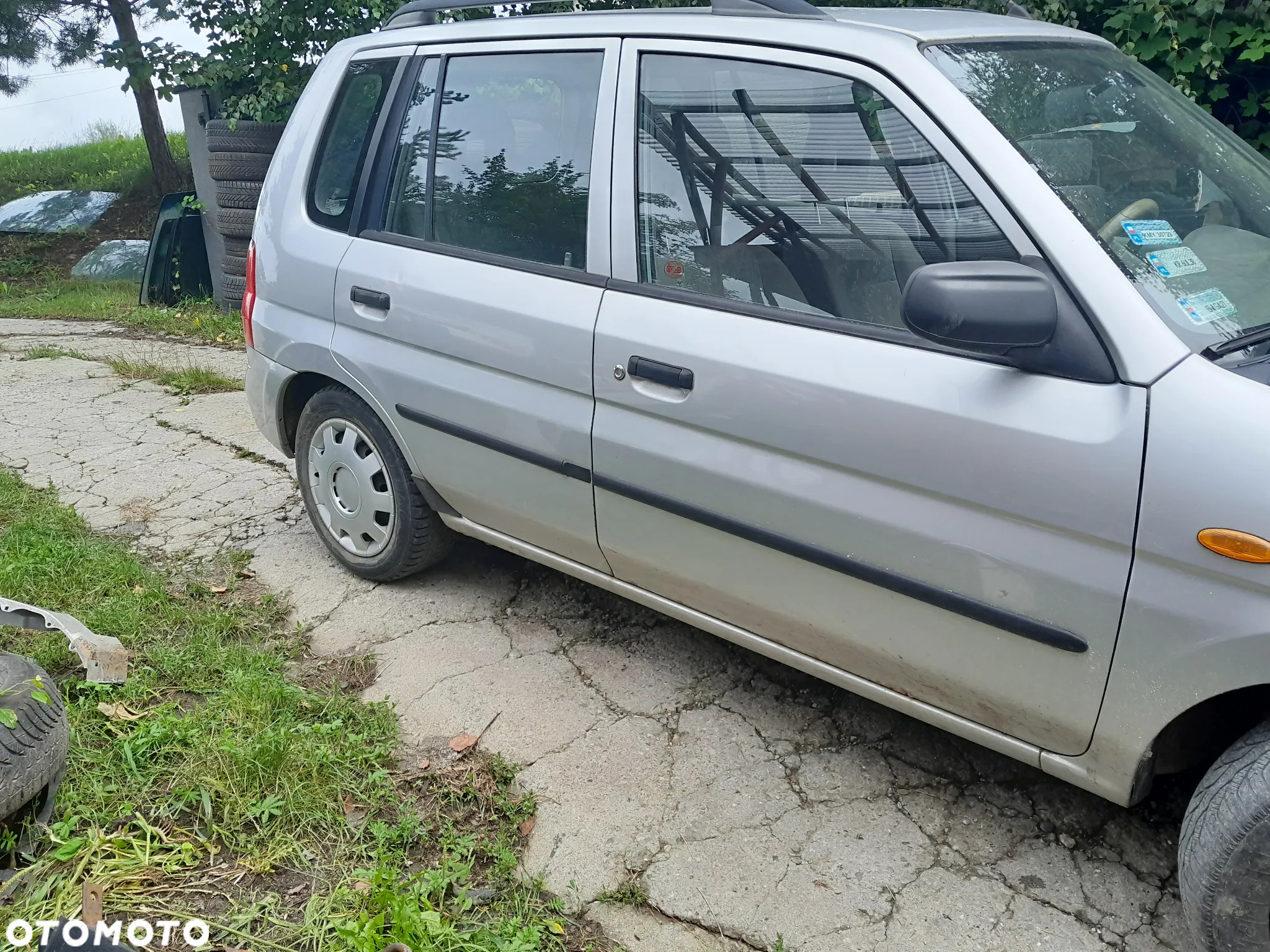 Mazda Demio  Amortyzator Sprężyna przód przedni - 4