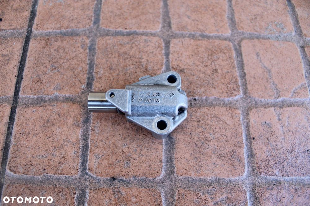 NAPINACZ ŁAŃCUCHA ROZRZĄDU OPEL CORSA D 1.3 CDTI 55197785 - 1