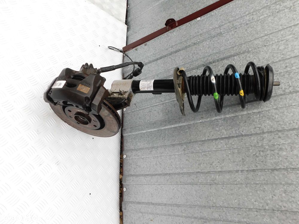 Noga piasta zwrotnica amortyzator zacisk Berlingo Peugeot Partner II