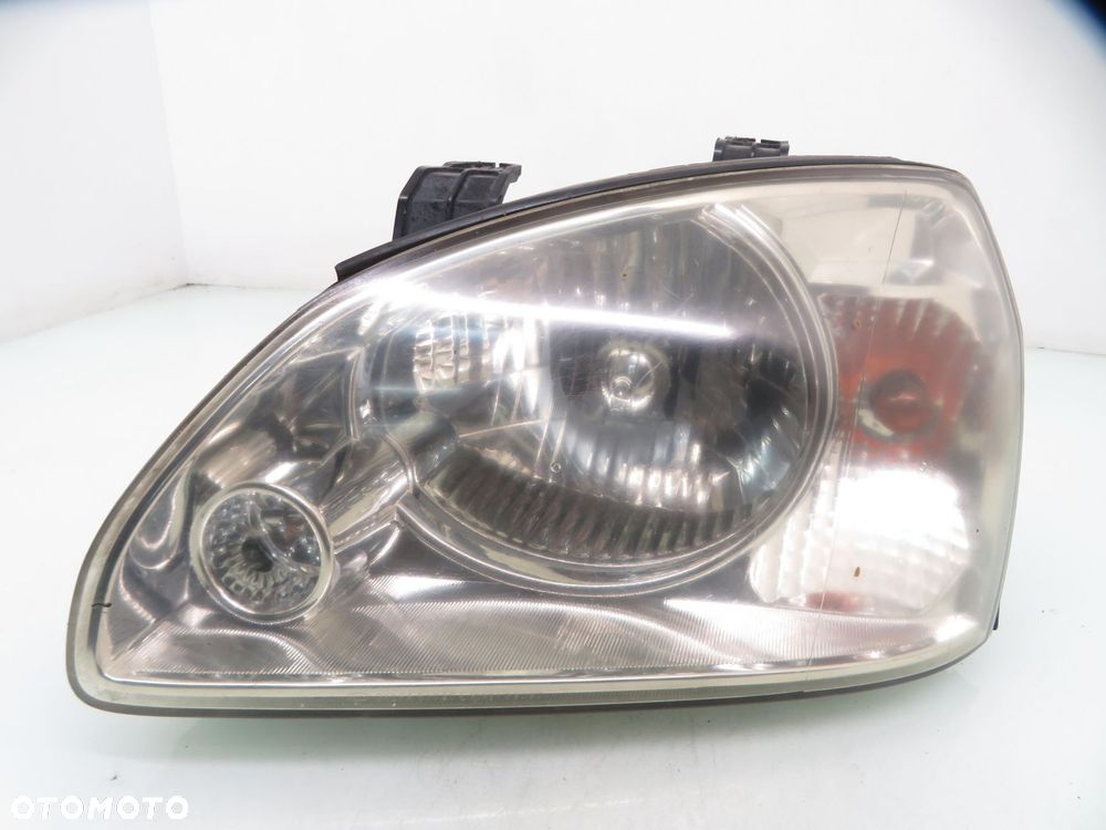 LAMPA LEWA PRZEDNIA KIA CARENS II - 1