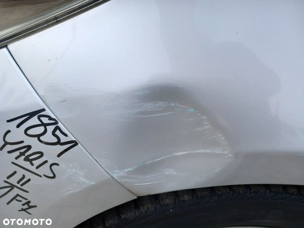 TOYOTA YARIS III BŁOTNIK LEWY PRZEDNI PRZEDNI LEWY PRZÓD KOLOR: 1F7 - 7