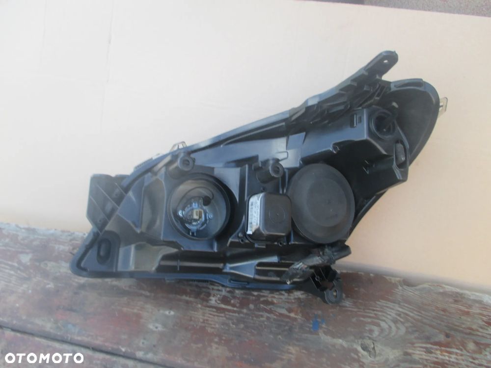 lampa prawa Opel Astra 3 H Hella Europa - 6
