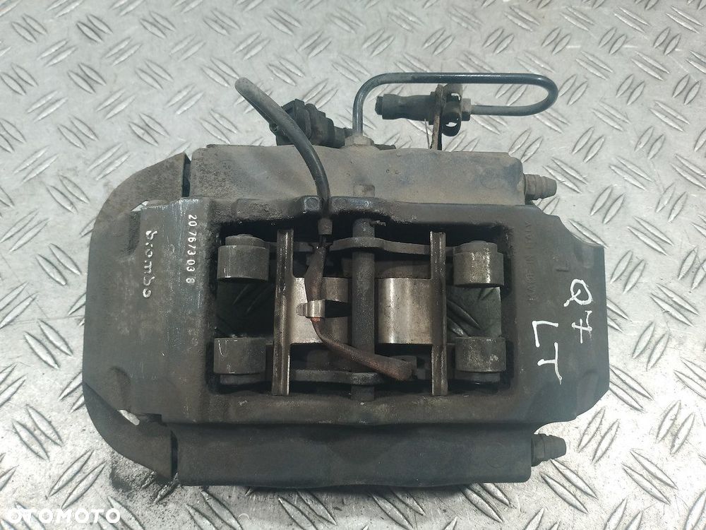 ZACISK HAMULCOWY LEWY TYŁ AUDI Q7 207673038 3.0 TDI - 6