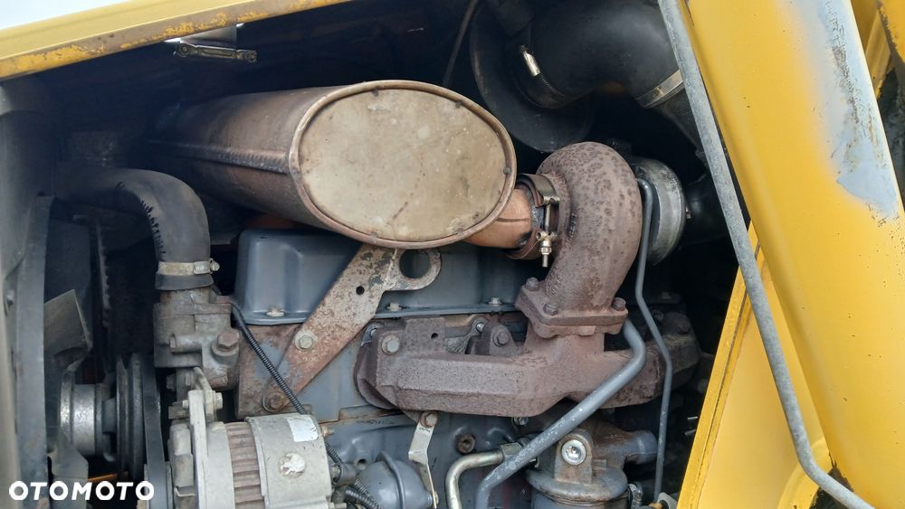 New Holland LB 115 - 34