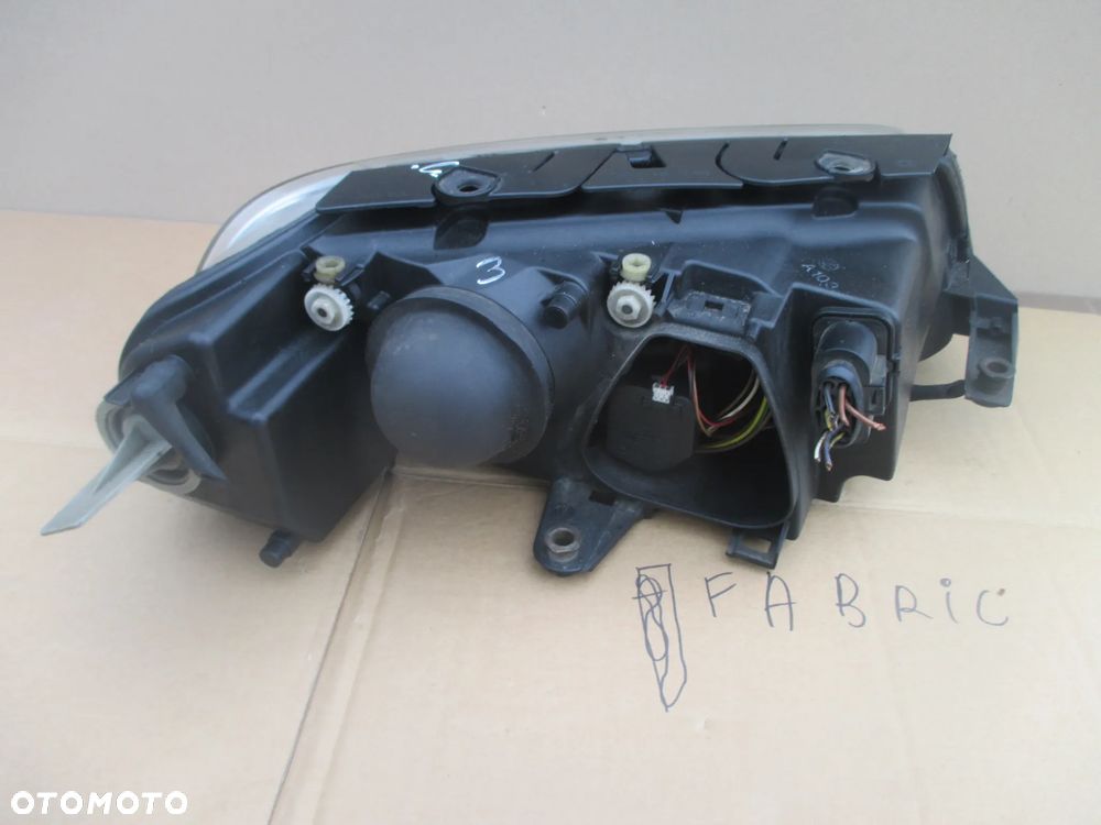 lampa lewa VW Passat B5 lift Hella Europa - 4