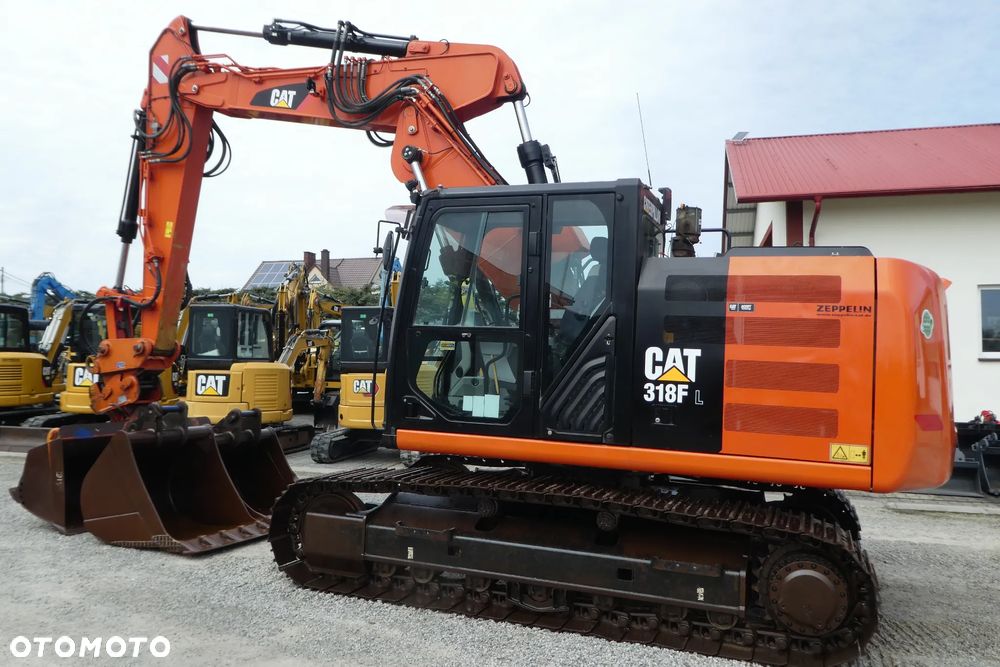 Caterpillar M 318F Z NIEMIEC TRZY ŁYŻKI - 32