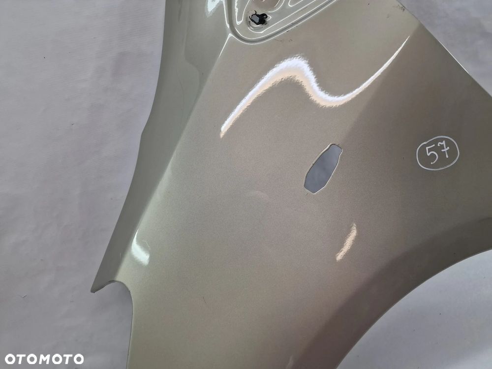 TOYOTA YARIS II LIFT 09-11 LEWY ŁADNY BŁOTNIK PRZEDNI PRZÓD , BEŻOWY METALIK , NR AUKCJI BŁ57 - 10