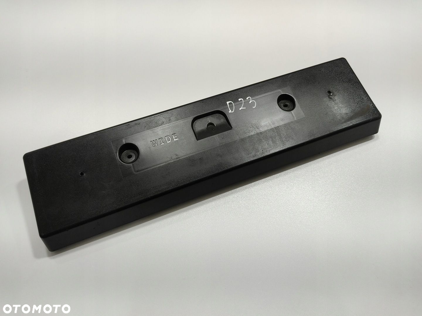 PODKŁADKA DOKŁADKA TABLICY REJESTRACYJNEJ NISSAN NAVARA IV D23 962104KJ0A - 2