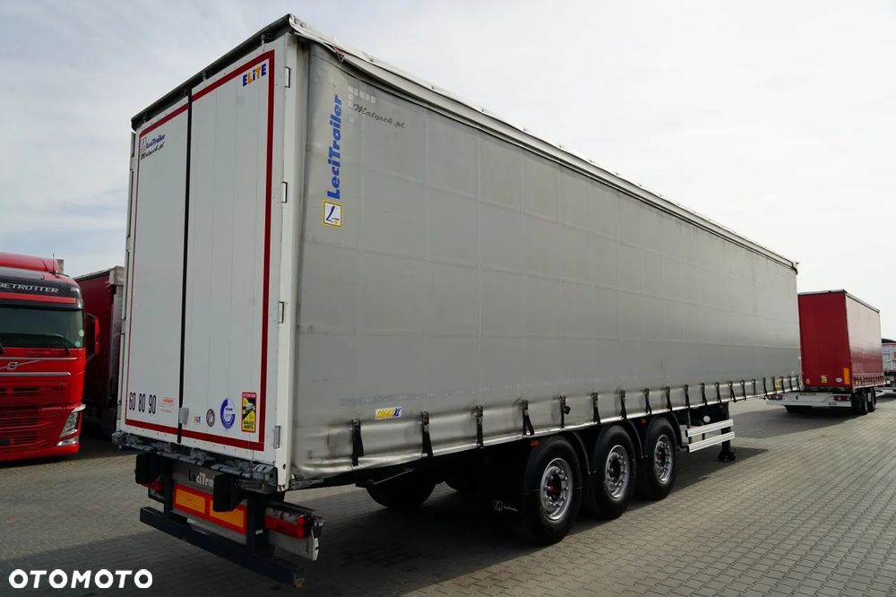 LeciTrailer FIRANKA / STANDARD / MOCNA PODŁOGA SZYNA DESKA / OŚ PODNOSZONA / OPONY 100%  / OSIE SAF - 8