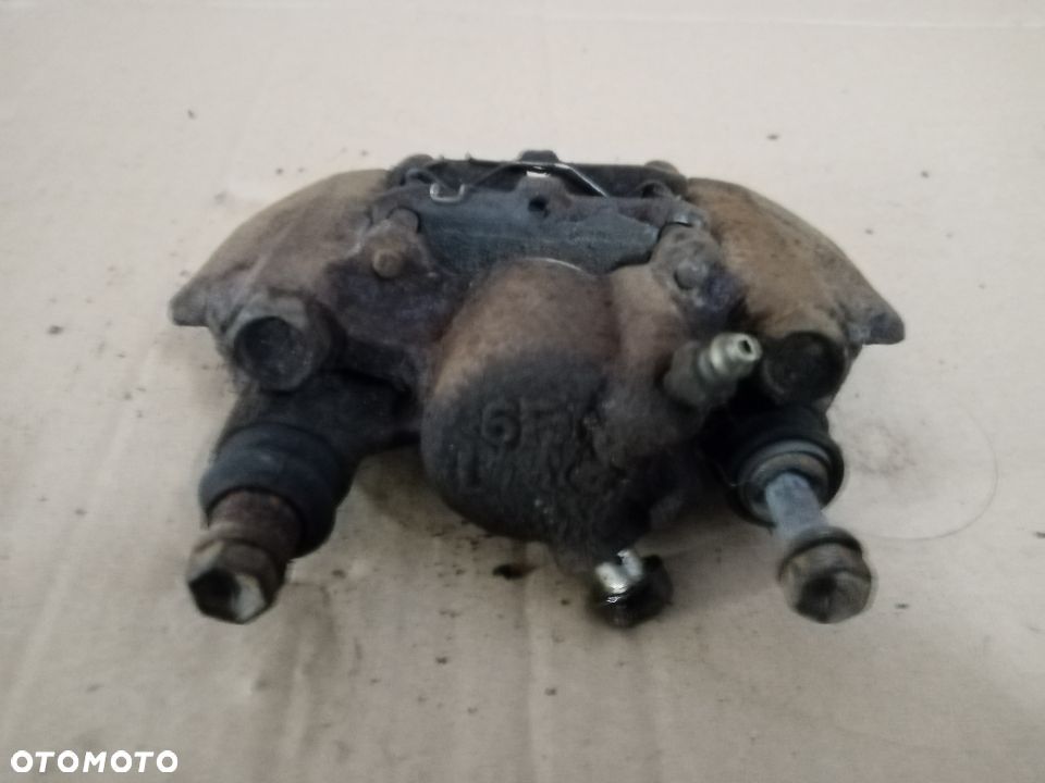 Zacisk hamulcowy lewy tył tylny Toyota Yaris I - 2