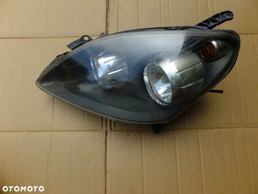 lampa lewy przód opel zafira b 2006r EUROPA 24451052 - 1