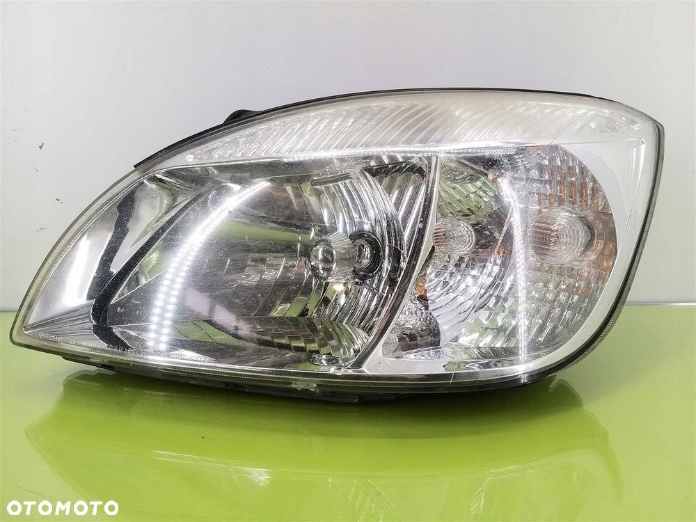 Reflektor lampa przód lewa Kia Rio II 2005-2009 PRZED LIFT 921011G0L - 1