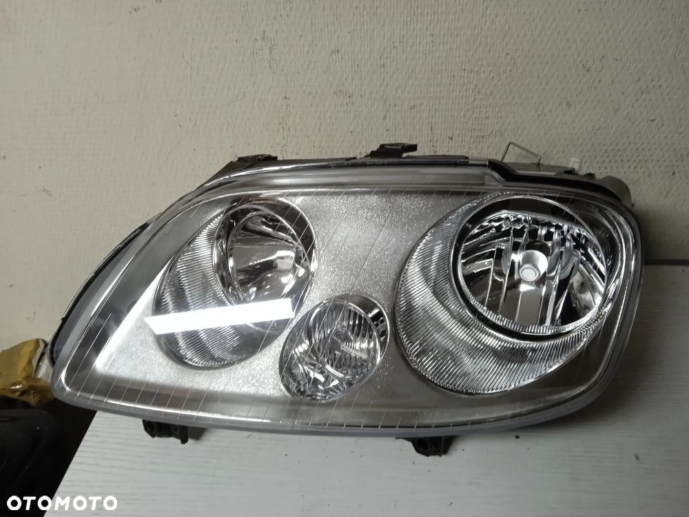 REFLEKTOR LEWY LUB PRAWY VW CADDY 04-10 TOURAN 03-06 NOWY - 1