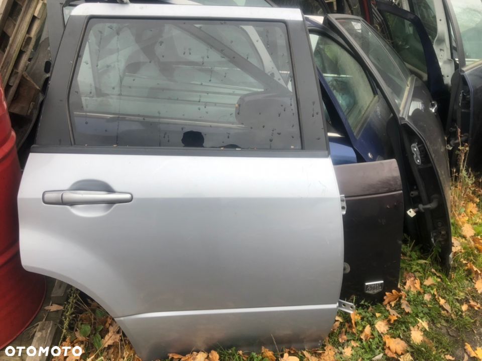 MITSUBISHI OUTLANDER I 03-06 DRZWI PRAWY TYŁ SZYBA PODNOŚNIK ZAMEK KLAMKA - 1