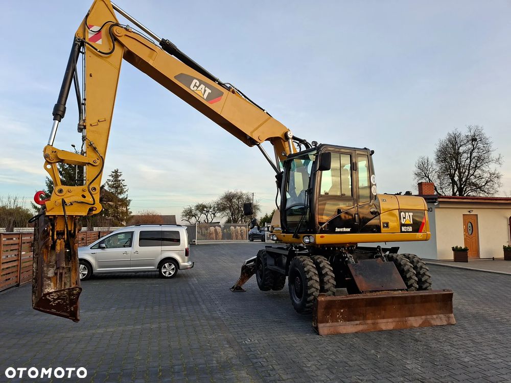 Caterpillar CAT M315D Rok 2011 - 12