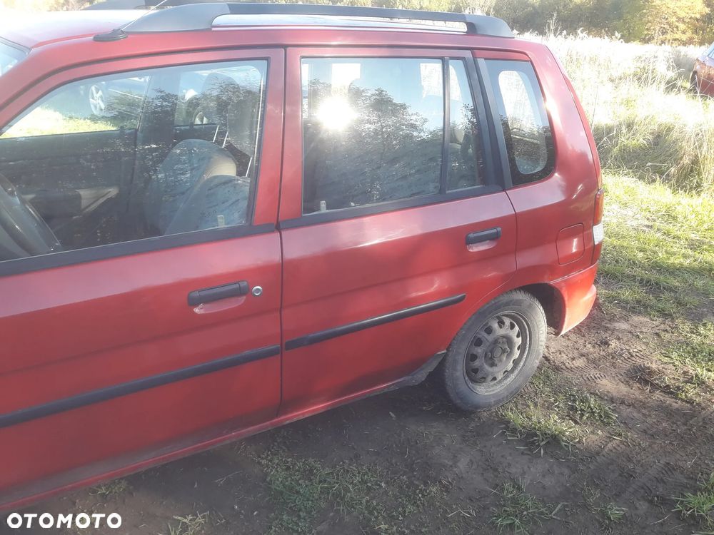 Mazda Demio 97-Klapa Zderzak tylny szybapas  lampa belka Kolor SU - 11