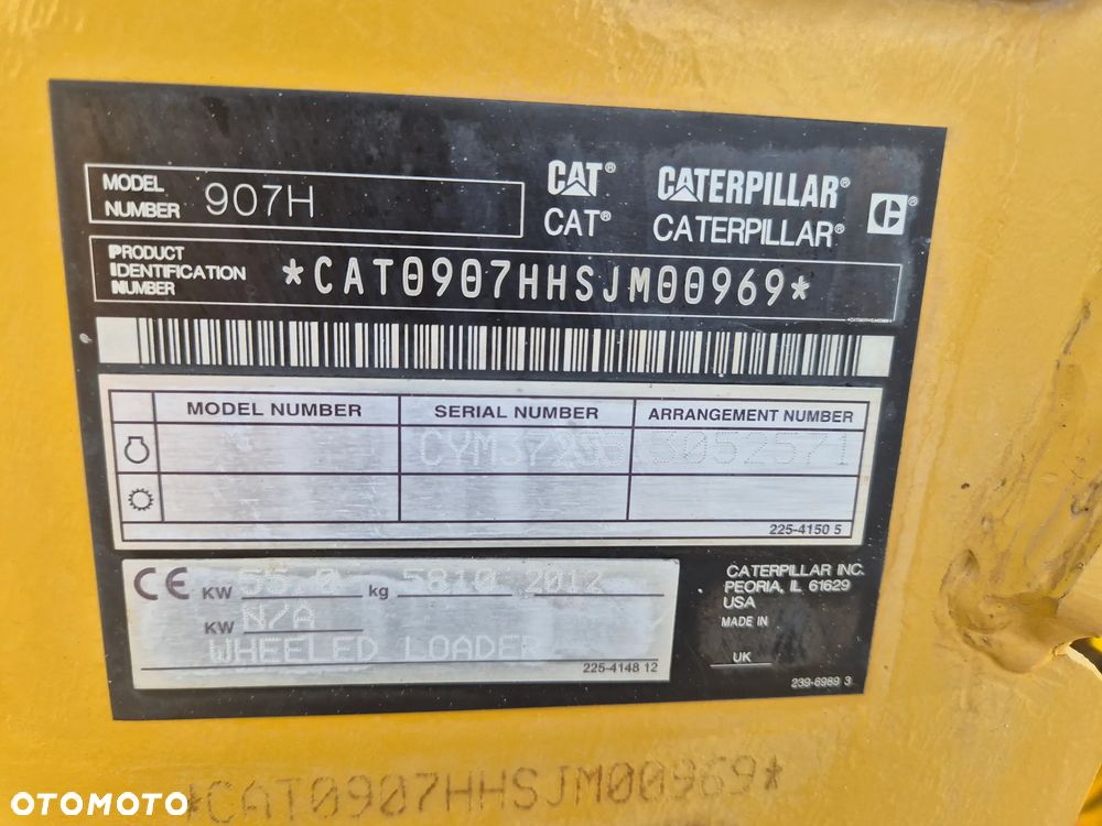 Caterpillar 907H / z Niemiec / Łyżka otwierana + Widły / 6700 mth / - 7