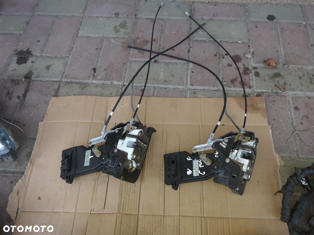 Mazda RX-8  Zamek drzwi prawy przód przedni Europ - 1