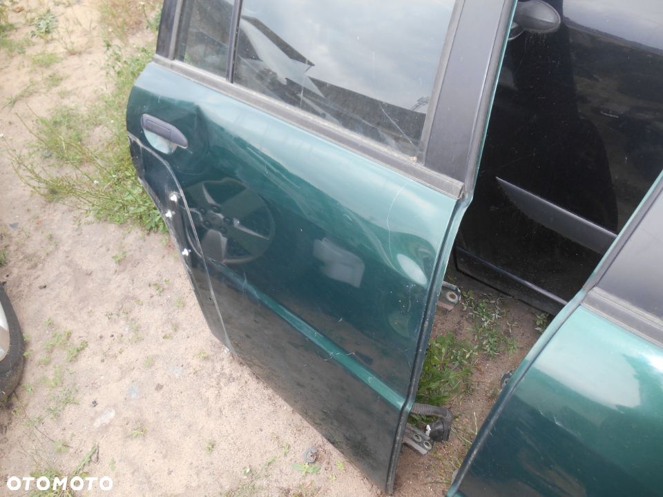 Drzwi prawe tył tylne Nissan Patrol Y61 lift GU4 3,0 Diesel - 2