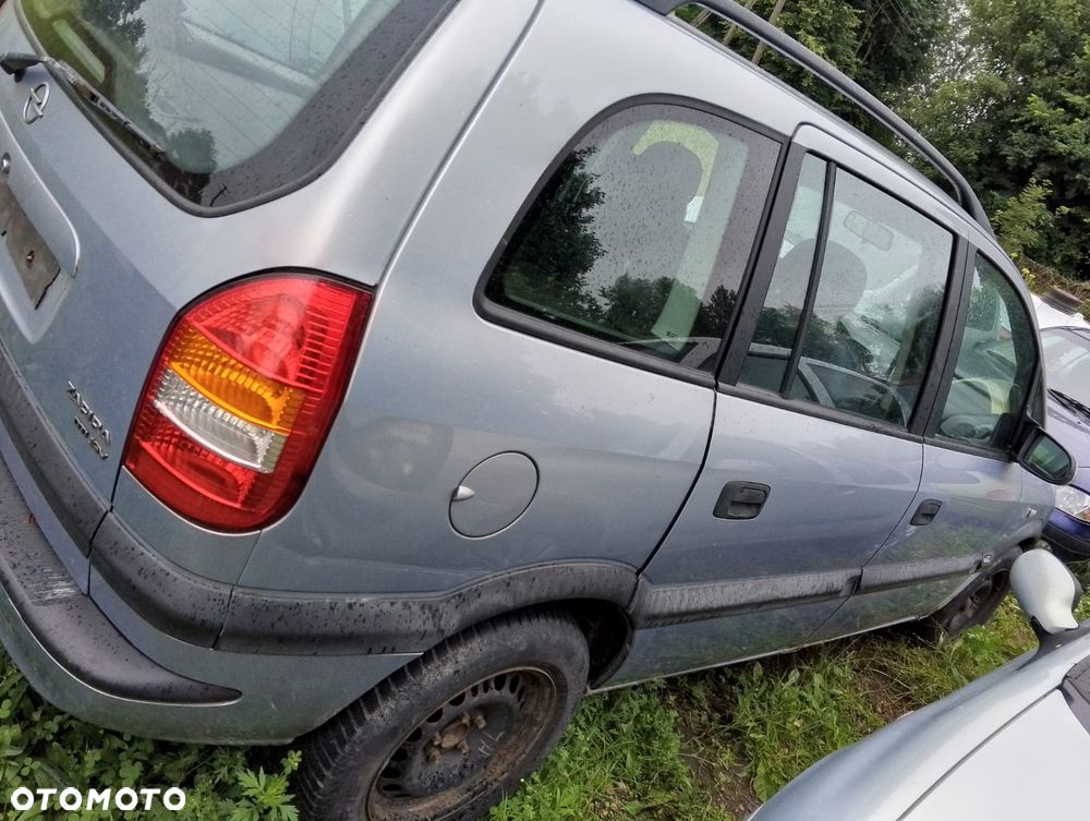Opel Zafira A (99-03r.) 2.0 DTI 100KM. Silnik Y20DTH Skrzynia F23 WR lakier Z 151 / 94L.Cały na części.GWARANCJA !!! Przód Tył Zestaw Komplet Drzwi Klapa Zderzak Błotnik Maska Grill Atrapa Szyba Pas Lampa Lusterko Boczki Fotel Kanapa Kokpit Deska Rozdzielcza Przełącznik Włącznik Sterownik Przewody Wiązka Instalacja Moduł Komputer Czujnik Listwa Pompa Alternator Wtryski Głowica Rozrusznik Kompresor Sprzęgło Dwumas Silnik Skrzynia ABS Klimatyzacji Paliwa Wspomagania Kolektor Turbina Przepustnica Zawór Chłodnica Koło Hak Belka Sanki Zawieszenie Mcpherson Półoś Amortyzator Wydech Tłumik Zacisk Most - 3