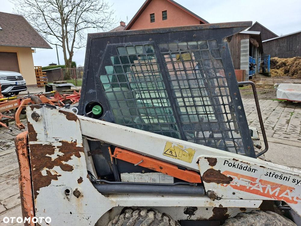 Bobcat 553 4X4 + Melroe Ingersoll-Rand 725S B/H - 24