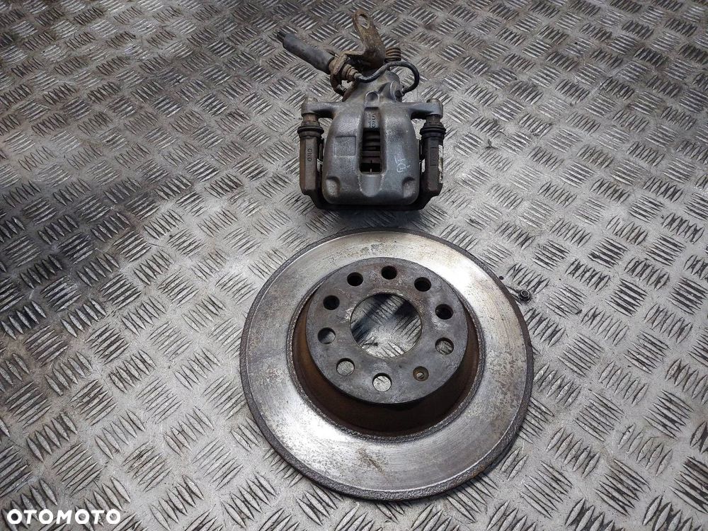 ZACISK HAMULCOWY PRAWY TYŁ + TARCZA SKODA SUPERB II - 1