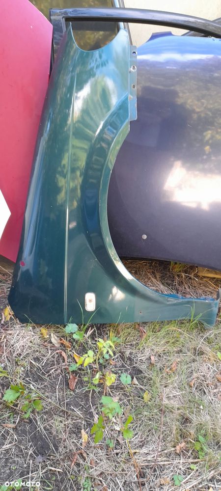 blotnik prawy lampa  Kia Carnival I  99-06r - 2